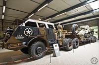 M26 Dragon Wagon transporter carrying an M4A4 Sherman tank
