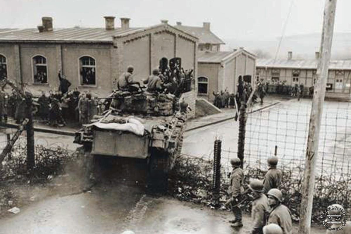 “An M4 medium tank of the 47th Tank Bn., 14th Armored Division crashes into the prison compound at Oflag XIII-B, 6 April 1945 two weeks after the failed Task Force Baum raid”, photo from US National Archives