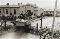 “An M4 medium tank of the 47th Tank Bn., 14th Armored Division crashes into the prison compound at Oflag XIII-B, 6 April 1945 two weeks after the failed Task Force Baum raid”, photo from US National Archives