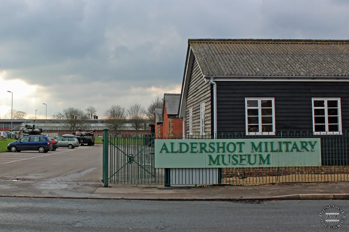 Main entrance with car park at left