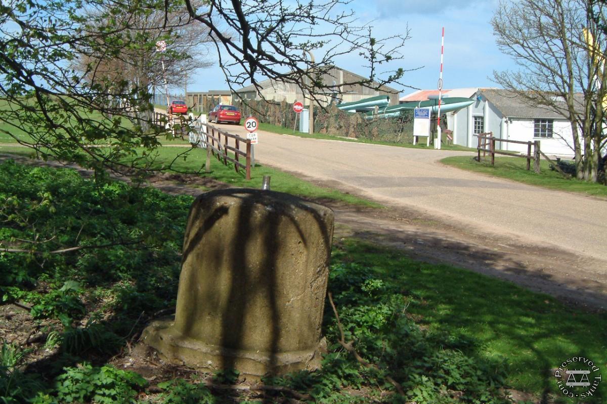 “Entrance to Muckleburgh Collection Weybourne. A WW2 spigot mortar base is shown in foreground” photo by Palmiped