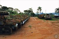 Stuart tanks and a Sherman missing its gun and mantlet