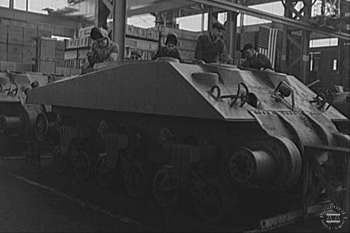 “Arc welders work on the partly-completed hull of a new M-4 tank at the Schenectady, New York, plant of the American Locomotive Company”