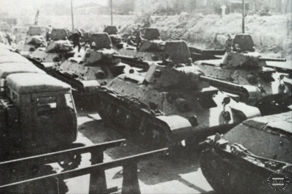 “During the grim days of the winter of 1941-42, little kept the tank forces from all but disappearing but the production of the STZ Factory in Stalingrad... Here, T34 41 and 42 tanks and STZ-5 tractors in the rail marshalling yards outside the factory are inspected before shipment”, photo and caption from WW2Total.com