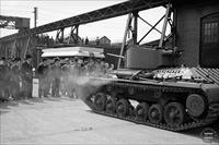 “A group of men, including military personnel, viewing the first Canadian-built tank, the Cruiser Tank, at the Angus Shops of the Montreal Locomotive Works” [sic] - vehicle is a Valentine tank, and the Angus Shops were part of Canadian Pacific