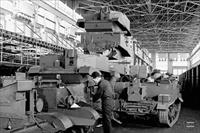 "Workmen assemble universal carriers (army vehicles) on the assembly line at the Ford Motor Co. plant"