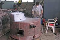 Turret being painted with primer